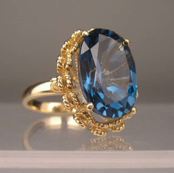 14k gold ring with oval Russian blue topaz measuri