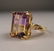192: Contemporary 14k gold ring with emerald cut ametri