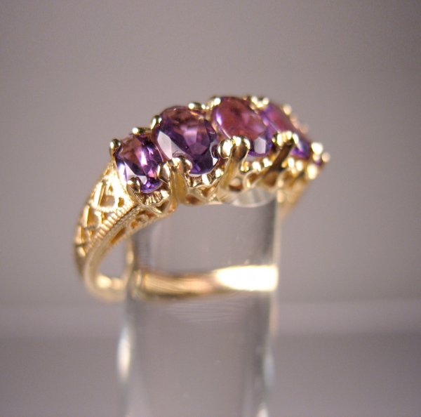 Contemporary 14k gold and amethyst ring set with f