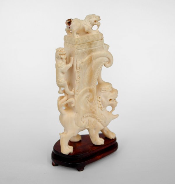 Carved figural ivory box with Chinese lions, 20th : Carved figural ivory box with Chinese lions, 20th C., measures 6 1/2" x 3 1/2", repair and loss at tail of lion on lid. .