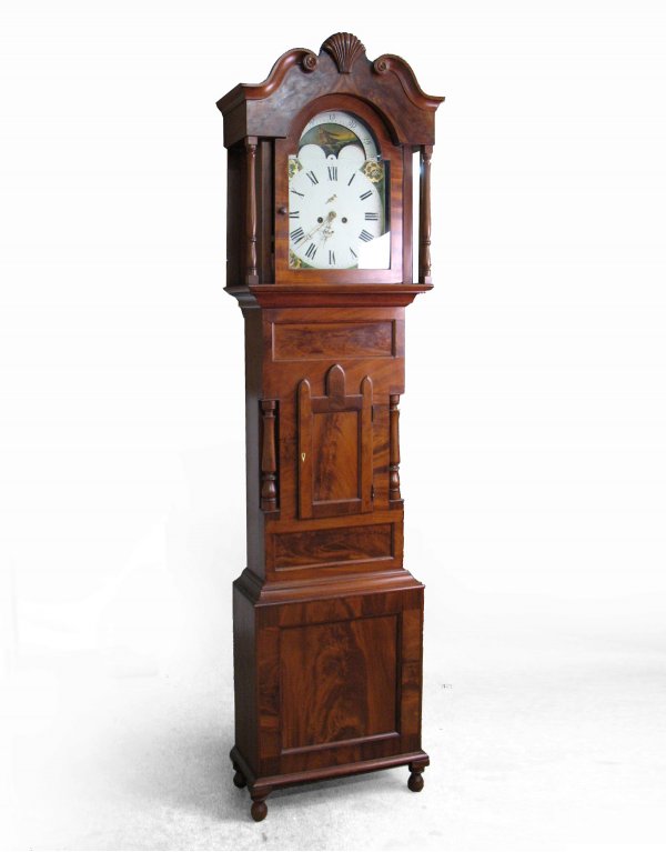 Scottish tall case clock, walnut case, painted tin: Scottish tall case clock, walnut case, painted tin dial and painted ship's dial, waisted case with Gothic door having ivory escutcheon, flanked by side columns at waist, base with recessed panel, on b