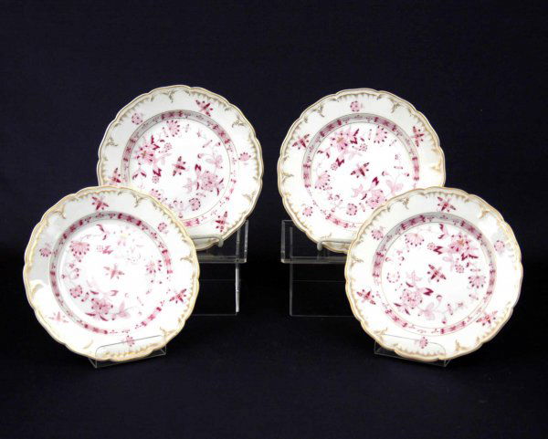 Set of four KPM plates, butterfly and floral design: Set of four KPM plates, butterfly and floral design, pink, magenta and gilt on white ground, raised scalloped rim, 8 1/2" diameter, blue underglaze mark and KPM on reverse.