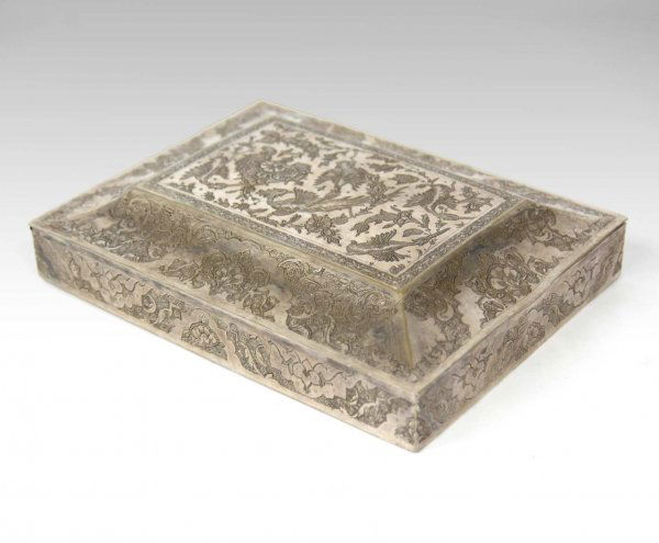 Iranian silver dresser box, hinged chamfered lid,: Iranian silver dresser box, hinged chamfered lid, all-over engraved decoration with bird, floral and foliate engraving on lid, 20.24 troy oz , 1 3/4" high x 5 3/4" x 7 3/4", hallmarked on bottom
