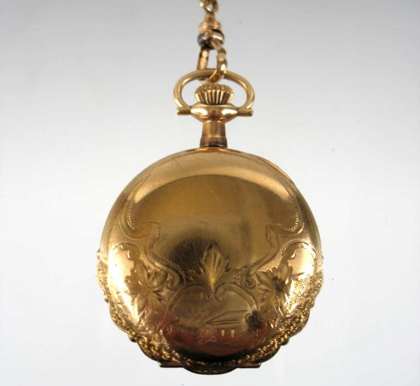 Lady's Elgin gold filled pocket watch with gold fi: Lady's Elgin gold filled pocket watch with gold filled slide chain, 1 1/2" diameter engraved hunting case number 2658653, 15 jewel movement number 17371946, 50" long chain with swivel and 10k gold sli