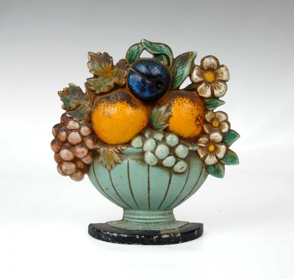 Cast iron fruit basket doorstop by Hubley number 4: Cast iron fruit basket doorstop by Hubley number 456. Measures 7" x 7". Early to mid 20th C.