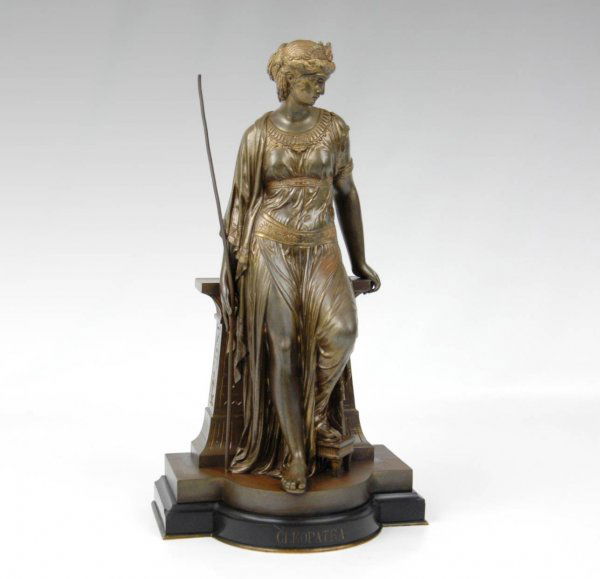 (Eutrope) Bouret, bronze sculpture "Cleopatra" in: (Eutrope) Bouret, bronze sculpture "Cleopatra" in draped gown resting on wall, signed and dated on base Bouret 1873, 15 1/2" high, titled on front of base