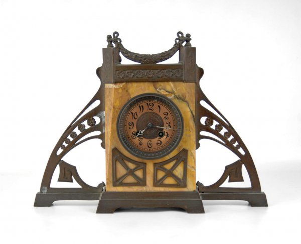 Art Deco mantle clock, marble case with bronze but: Art Deco mantle clock, marble case with bronze buttresses and mountings, bronze cornice with floral swag, copper dial, works are marked Lenzkirch, C. 1910, 12" high x 14 1/2" across x 5" deep.