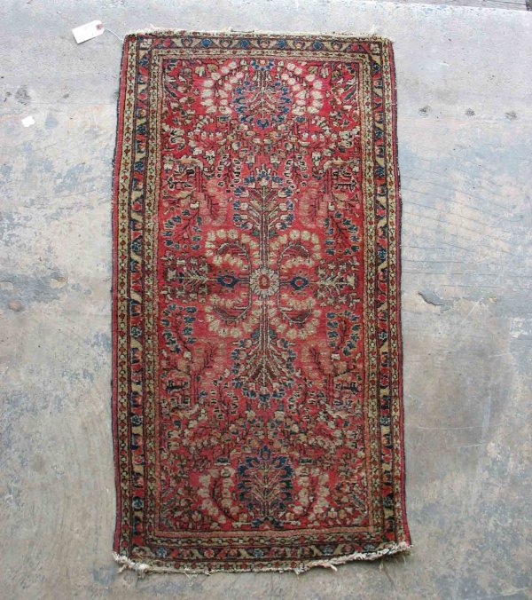 Hand tied Oriental rug, "Sarouk", red ground, earl: Hand tied Oriental rug, "Sarouk", red ground, early to mid 20th C., 25" x 47".