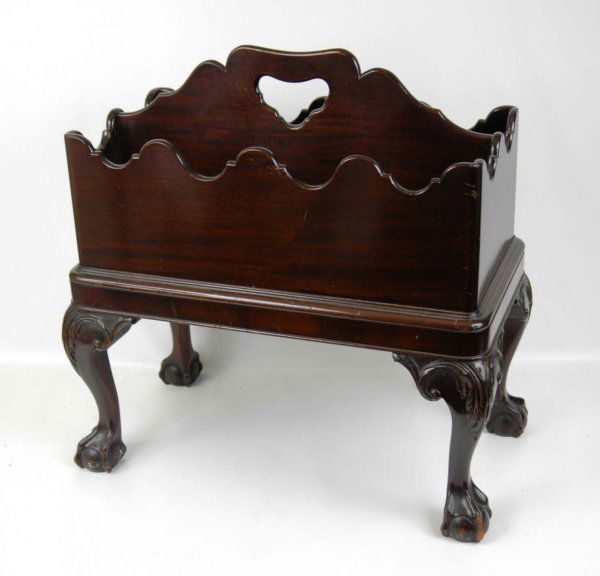 Walnut canterbury, scalloped rim with centered han: Walnut canterbury, scalloped rim with centered handle, rectangular form, cabriole legs on ball and claw feet, mid 20th C., 24" high x 23" across x 13" deep.