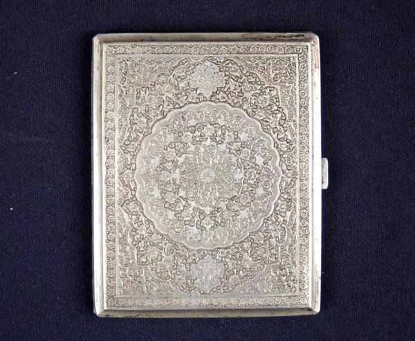 Iranian silver cigarette case, repousse design on: Iranian silver cigarette case, repousse design on front and back, front with center medallion, 3 1/4" x 4", 4.56 troy oz.
