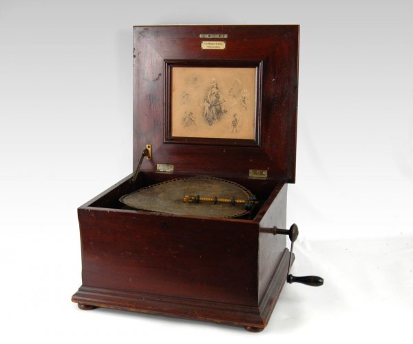 Regina music box, tabletop: Regina music box, tabletop model, C. J. Heppe & Son Philadelphia tag, 12" disc, black and white print inside lid, mahogany case, 10 1/2" x 16 3/4" x 15 1/2", early 20th C.