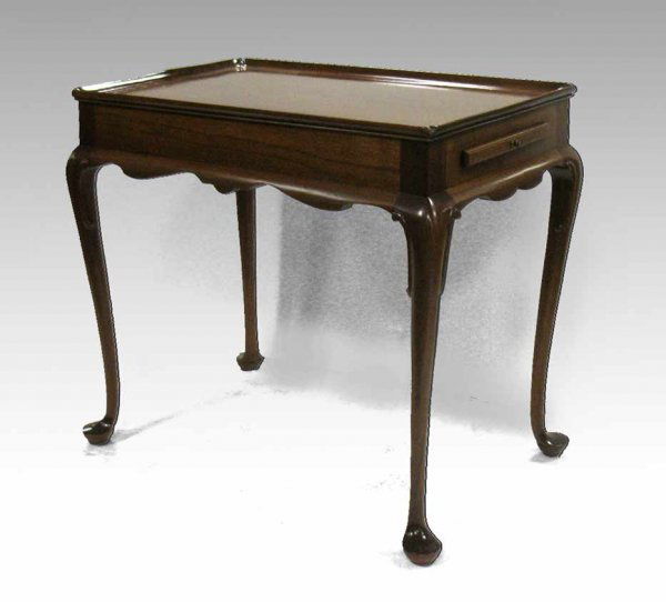 Kittinger mahogany tea table, Queen Anne style, re: Kittinger mahogany tea table, Queen Anne style, rectangular dish top, pull-out tray on each end, cabriole legs on pad feet, 26" high x 29" x 18", mid to late 20th C.