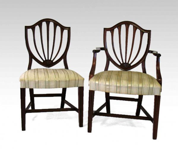 Set of eight Kittinger Biggs mahogany dining chair: Set of eight Kittinger Biggs mahogany dining chairs, curved crest rail over shield back, upholstered seats over square tapered legs with stretchers, includes two armchairs and six side chairs, Biggs c