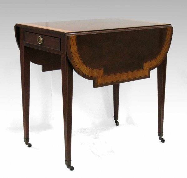 Baker inlaid mahogany Pembroke table, banded inlay: Baker inlaid mahogany Pembroke table, banded inlay, scalloped drop leaves, string inlay on legs, cockbeading around drawer, on casters. Metal tag inside drawer, 28" high x 19" x 30", 11" leaf, late 20