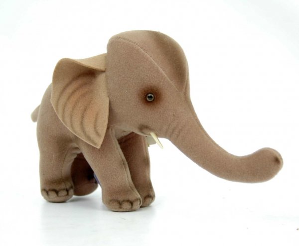 Steiff elephant, 5 1/2' high, 9" long including tr: Steiff elephant, 5 1/2' high, 9" long including trunk, silver ear button and cloth tag, paper hang tag "Trampy" with cloth tag stapled to it, additional paper hang tag