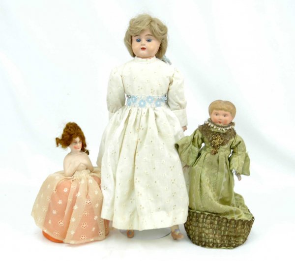 Two Minerva Germany tin head dolls, and compo pin : cushion doll, two Minerva Germany tin head dolls, both marked Germany on back, including 18", new cloth body, bisque arms and legs, blue stationary eyes, open mouth with teeth, blonde replaced wig, sl