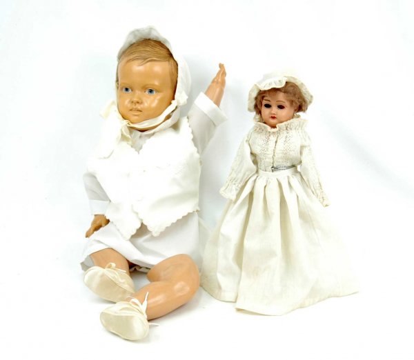 Two dolls including celluloid baby, 22", marked "D: Two dolls including celluloid baby, 22", marked "DRP" on back of shoulders, Deutsches Reichs Muster Rolle (German), early 20th C., blue eyes, brown molded hair, one leg needs to be reattached; and cel