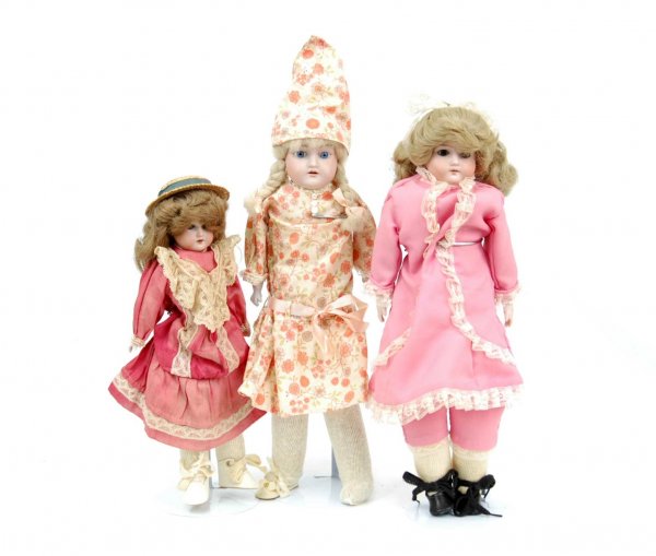 Three bisque head dolls including 16" shoulder hea: Three bisque head dolls including 16" shoulder head marked "Mabel 9/0" on back, blue stationary eyes, open mouth with teeth, replaced body and wig; 16" shoulder head marked "Made in Germany on back", 