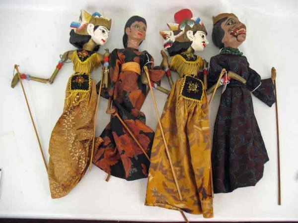 Four puppets, carved wooden faces and bodies, stic: Four puppets, carved wooden faces and bodies, stick below skirt and wooden rods to operate each hand, includes: Oriental man "Rama" and woman "Sinta"; Oriental woman in floral kimono and Oriental man 