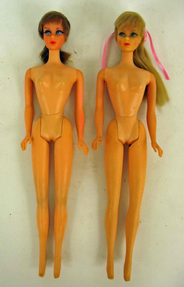 Two blonde Twist 'n Turn Barbies, both dated 1966,: Two blonde Twist 'n Turn Barbies, both dated 1966, one has lighter blonde hair, wear to makeup, original hairdo, darker blonde doll's hair may be cut, pink mark on left arm, wires showing on bottoms o