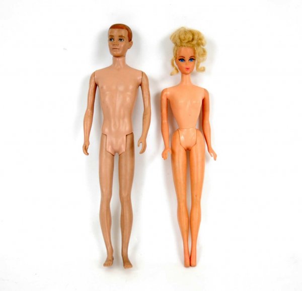 Brown flocked hair Ken marked on back "MCMLX, Matt: Brown flocked hair Ken marked on back "MCMLX, Mattel", hair worn completely off, some marks on face, legs slightly bent to side below knee and blonde Twist 'n Turn Barbie, marked 1966 Mattel, Made in 