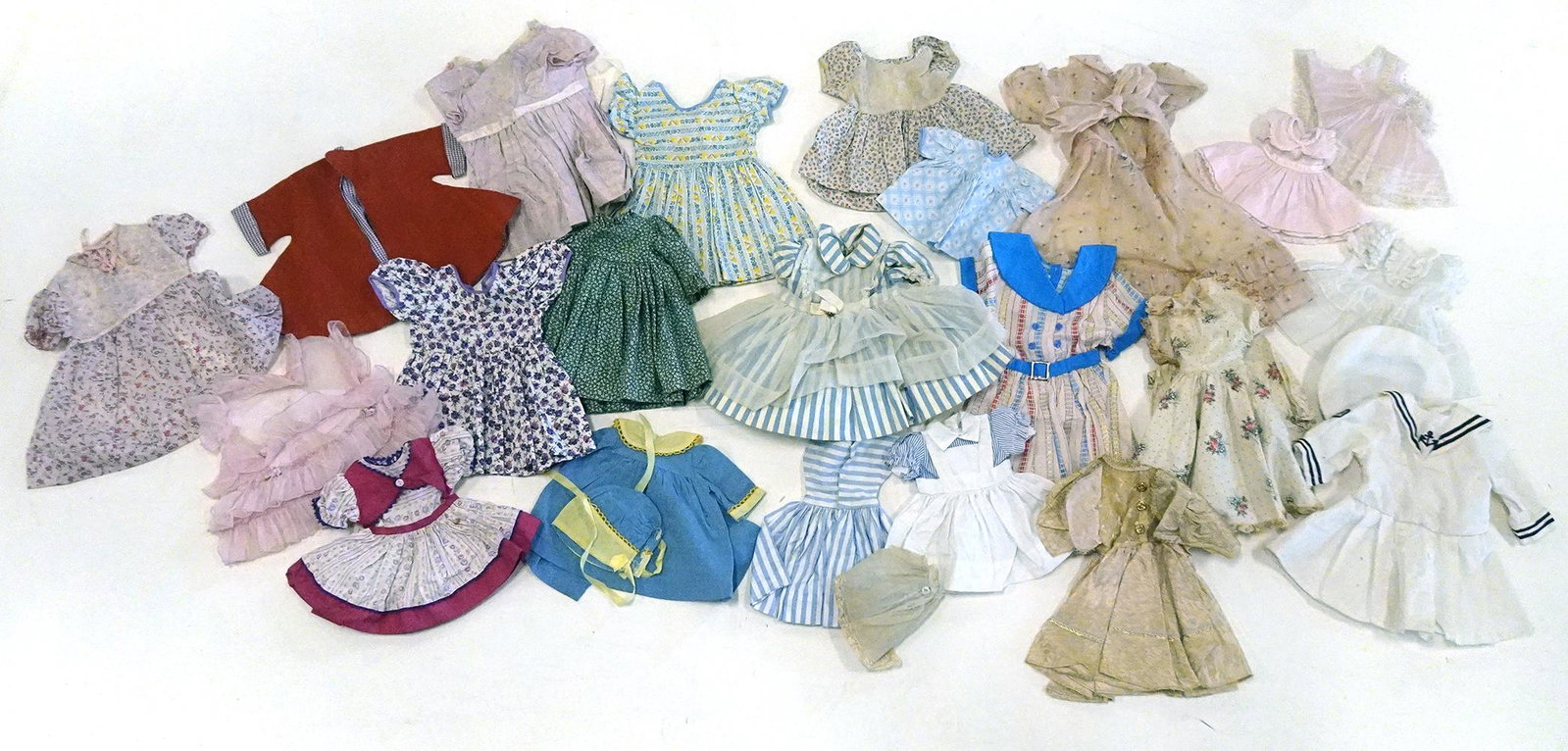 Group of vintage 1940's-60's doll clothing: Group of vintage 1940's-60's doll clothing, mostly dresses, few may be older, assorted sizes and makers'