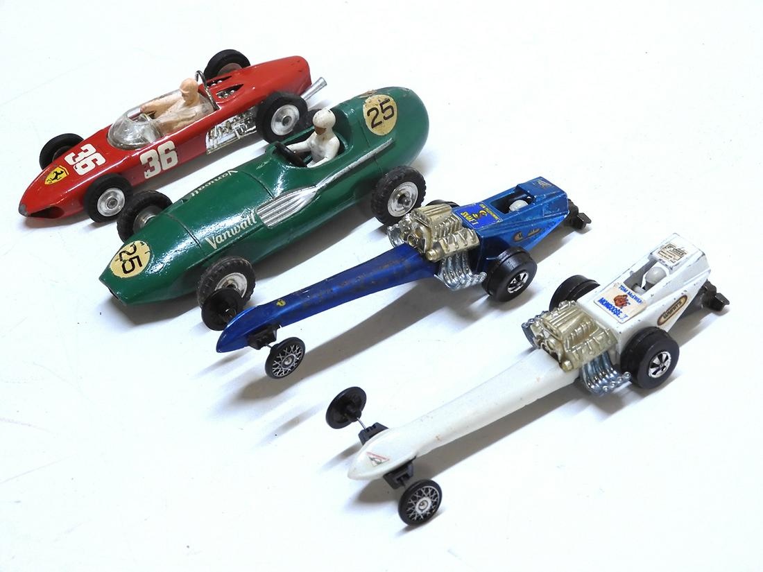 Four 1960's-1970's die cast and plastic race cars by: Four 1960's-1970's die cast and plastic race cars by various manufacturers. There are two Hot wheels 1971 Fuel Dragsters with slightly warped front ends. One blue and one white. A 1960's Meccano Dinky
