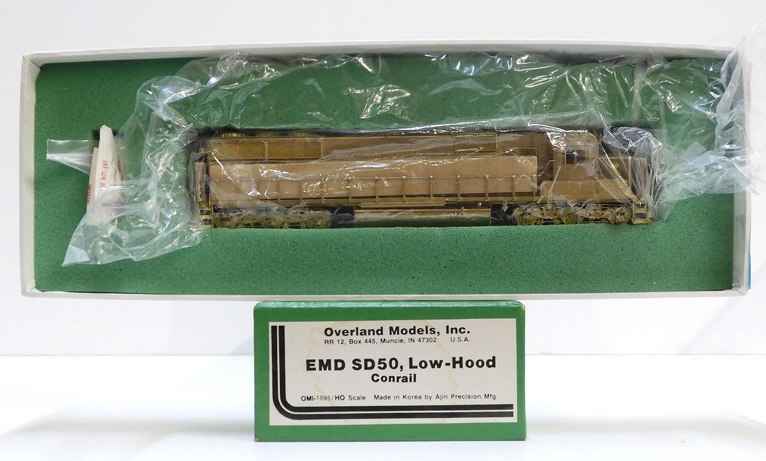 Brass HO gauge EMD SD50, Low Hood (Conrail): Brass HO gauge EMD SD50, Low Hood (Conrail), 1980's Overland Models by AJIN (Korea) unpainted,10" long. Still wrapped in factory plastic. Box 15" X 5" X 3".