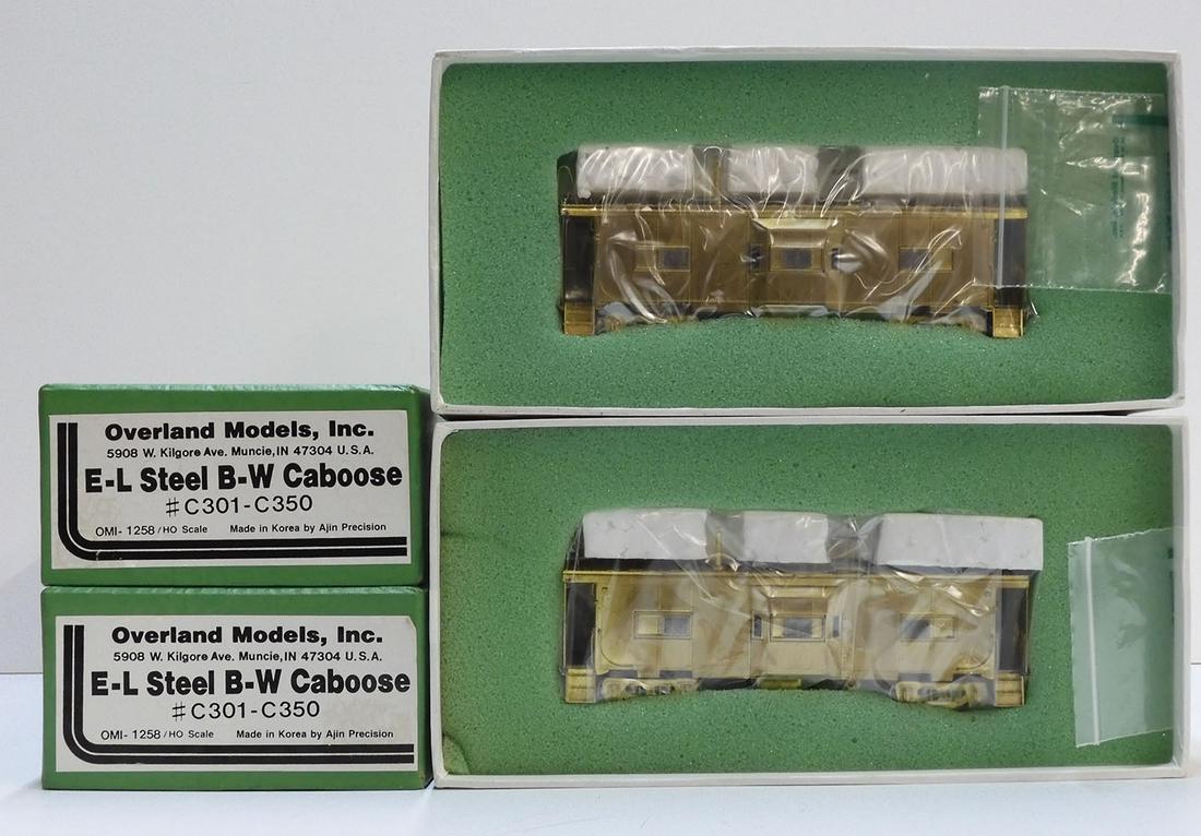 Two brass HO gauge E-L Steel Bay Window cabooses (1 of 4)