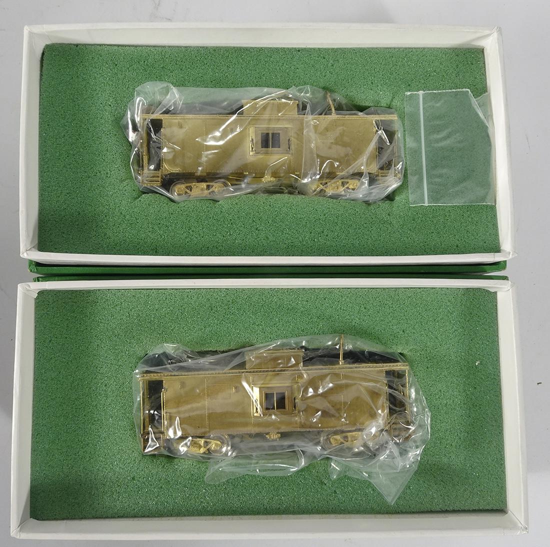 Two brass cabooses in original boxes (1 of 2)