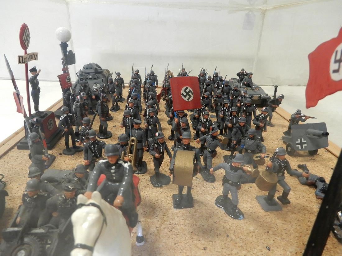 Nazi Diorama with figures and vehicles in plastic case: Nazi Diorama with figures and vehicles in plastic case. Case is sealed. Over fifty figures of Nazi soldiers and four vehicles. Diorama measures 24" X 18" X 8", handcrafted.