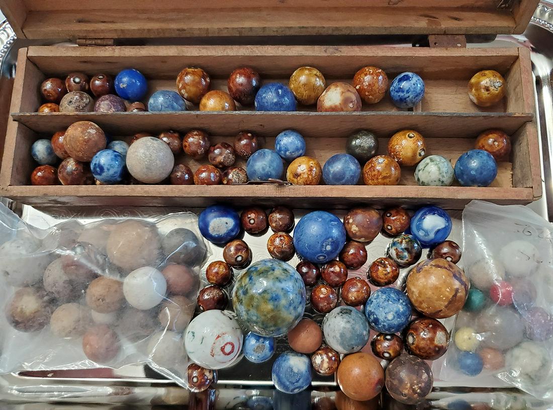 Antique Bennington Glaze Marbles: Various sizes and colors of antique marbles including Bennington glaze, china and other clay with a wooden box. Sizes range from 30mm-10mm.