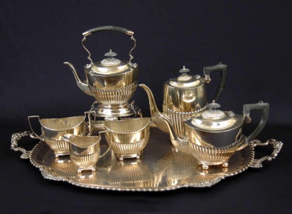 English Cameo silver plated tea & coffee service o: English Cameo silver plated tea & coffee service on oval tray, and a domed silver plated serving dish. Tea and coffee service consists of hot water kettle with spirit burner, coffee pot, teapot, sugar
