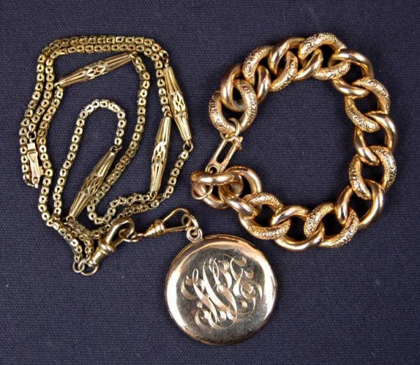 Victorian gold filled charm bracelet and locket wi: Victorian gold filled charm bracelet and locket with fancy chain, bracelet is 6 1/2" l x 1/2" wide, modern 14k gold replacement catch; and locket measuring 1 1/4" in diameter, engraved initials, inclu
