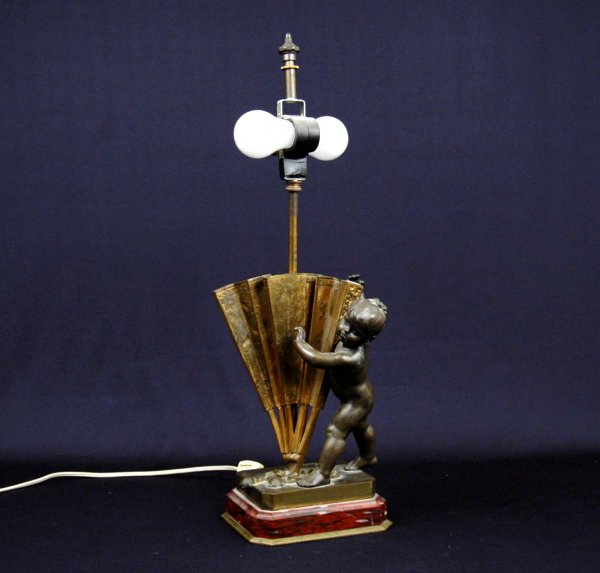 H. Moreau bronze lamp with cherub holding fan, sig: H. Moreau bronze lamp with cherub holding fan, signed H. Moreau on base, two light, late 19th C.20 1/2" high x 6 1/2" x 5