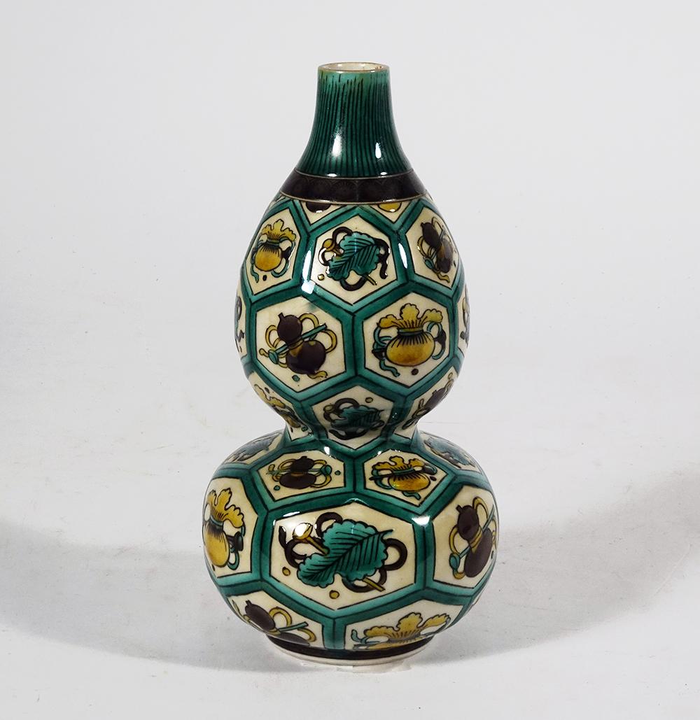 Japanese Kutani Porcelain Gourd Vase: Japanese Kutani porcelain gourd form vase decorated with leaf and symbol motifs, late 19th/early 20th c. Meiji/Taisho period, Tokuda Yasokichi I artist signed on base, 7"