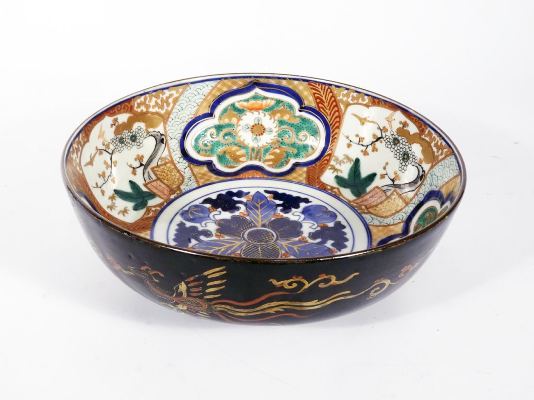 Antique Japanese Imari Porcelain Bowl: Antique Japanese Imari porcelain bowl, inner portion with Imari floral designs, outer portion with rare black glaze that has enamel Phoenix Bird and floral designs, unsigned, 19th c. Meiji period, 3 1