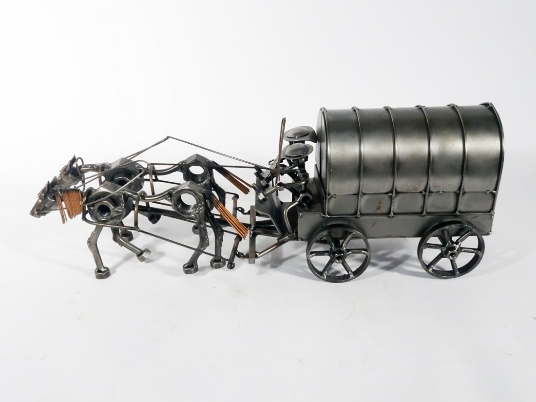 Nuts and Bolts Metal Artisan Sculpture: Nuts and bolts metal artisan sculpture in the form of a horse drawn buckboard covered wagon with 2 figures, contemporary 20th c., unsigned, 7" x 22" x 5 1/2"