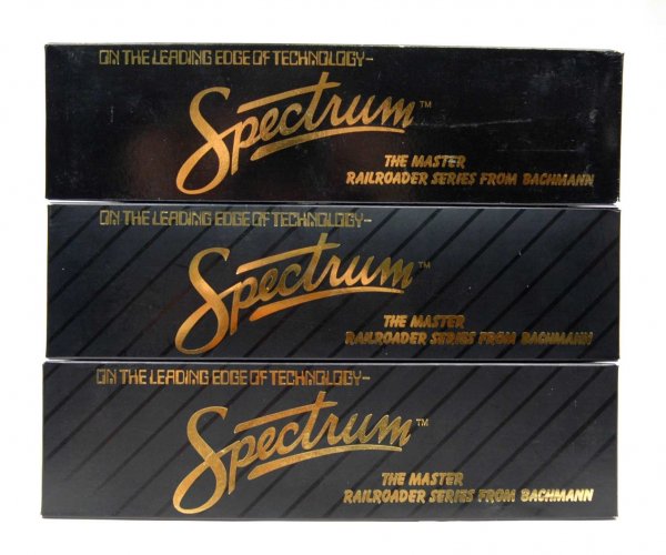Three HO gauge Bachmann Spectrum train cars includi: Three HO gauge Bachmann Spectrum train cars including No. 81405 Gas Electric Doodlebug Union Pacific, No. 81410 Gas Electric Doodlebug Santa Fe War Bonnet, and No. 89111 1920's - 1930's Passenger Car,