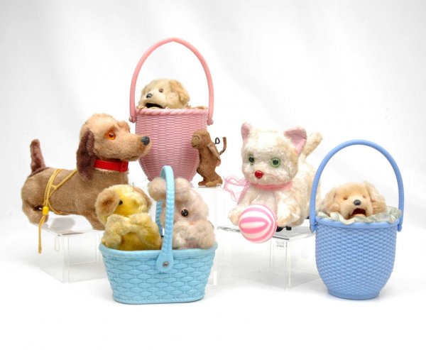 Six animated animal toys including two wind-up pupp: Six animated animal toys including two wind-up puppies in baskets, one wind-up puppy and bunny in basket, (all marked made in Japan,) wind-up monkey, battery operated dachshund made in Hong Kong and b