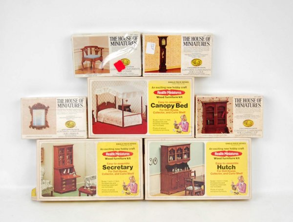 Seven dollhouse furniture miniatures kits including: Seven dollhouse furniture miniatures kits including Realife Miniatures canopy bed, hutch and secretary, and The House of Miniatures grandfather's clock, mirror, cabinet top and Chippendale corner chai