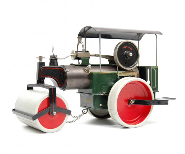 Fleischmann steam roller, paper label on body, with: Fleischmann steam roller, paper label on body, with removeable tin roof, 8 1/2" high, 12" long, 6" wide, marked Made in Western Germany on bottom