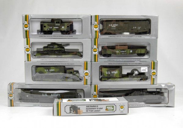 AHM U.S. Army HO train set, engine, six freight ca: AHM U.S. Army HO train set, engine, six freight cars, one caboose, one freight loader, all in original boxes