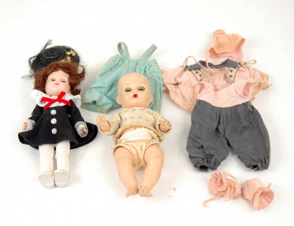 Two Vogue dolls including Ginny bend knee walker 7: Two Vogue dolls including Ginny bend knee walker 7 1/2", and Ginnette vinyl doll, with overalls, tagged shirt and snowsuit