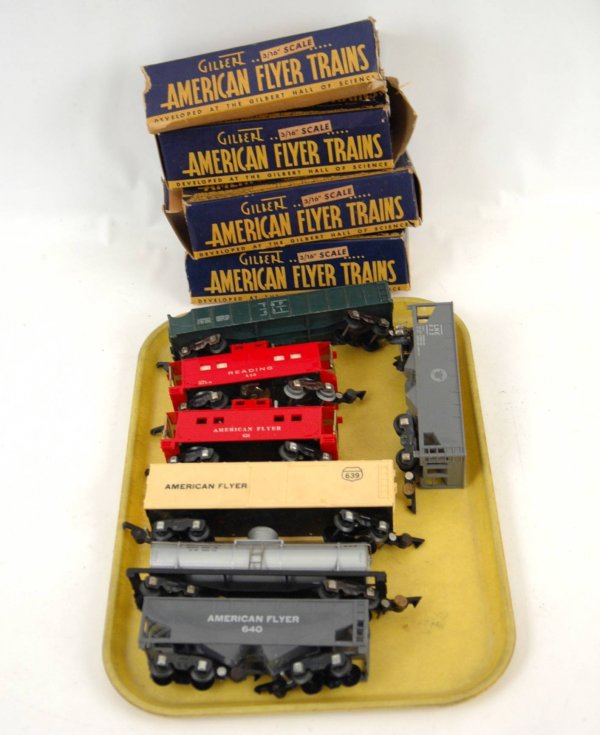 Seven American Flyer S Gauge train cars including : Seven American Flyer S Gauge train cars including two cabooses #630 and #638, one freight car #639, two hopper cars #632 and #640,one tank car #625, one car #631, four boxes
