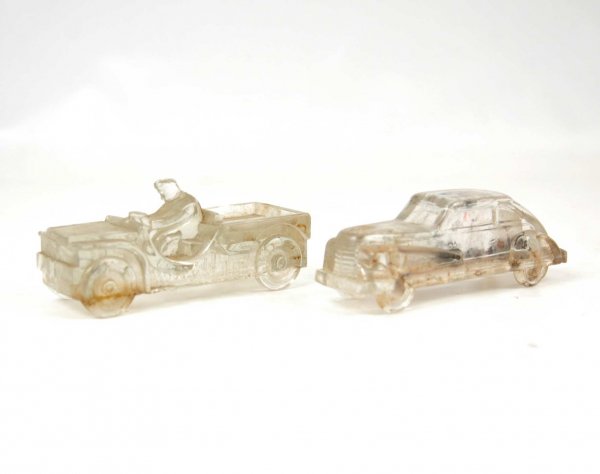Two glass candy containers including Willys Jeep a: Two glass candy containers including Willys Jeep and "Miniature Streamline Auto" with original paper seal in base