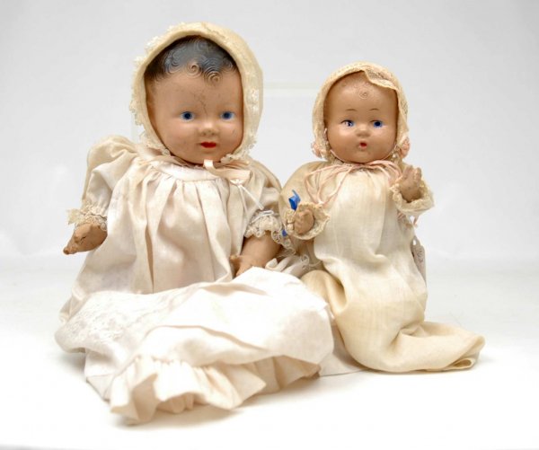 Two compo baby dolls including 12" unmarked, brown: Two compo baby dolls including 12" unmarked, brown molded hair, blue painted eyes, crazing and cracks in compo, loss to baby finger on right hand, and 9 1/2" unmarked, light brown molded hair, blue pa