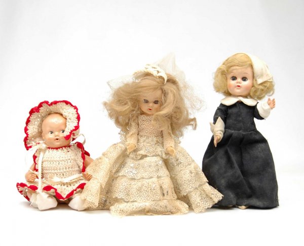 Three hard plastic dolls including 8" bride, 8 1/2: Three hard plastic dolls including 8" bride, 8 1/2" Pilgrim lady, 7 1/2" baby in crocheted dress and hat