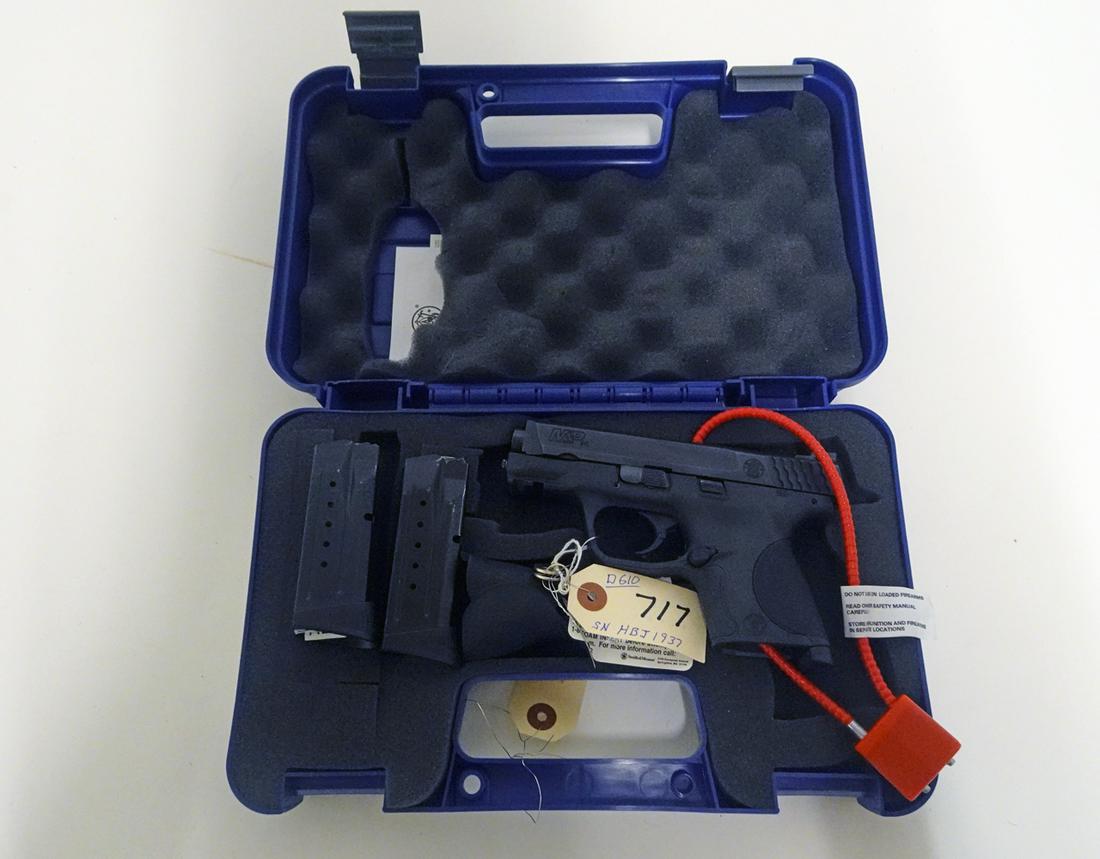 Smith & Wesson M & P 9 Semi-Automatic Pistol: Smith & Wesson model M & P 9-C pistol, semi-automatic, 9mm caliber, 12 shot, 2 magazine feed, serial number HBJ1937, barrel length 3 1/2", overall length 6 1/2", comes with hard side carry case, facto