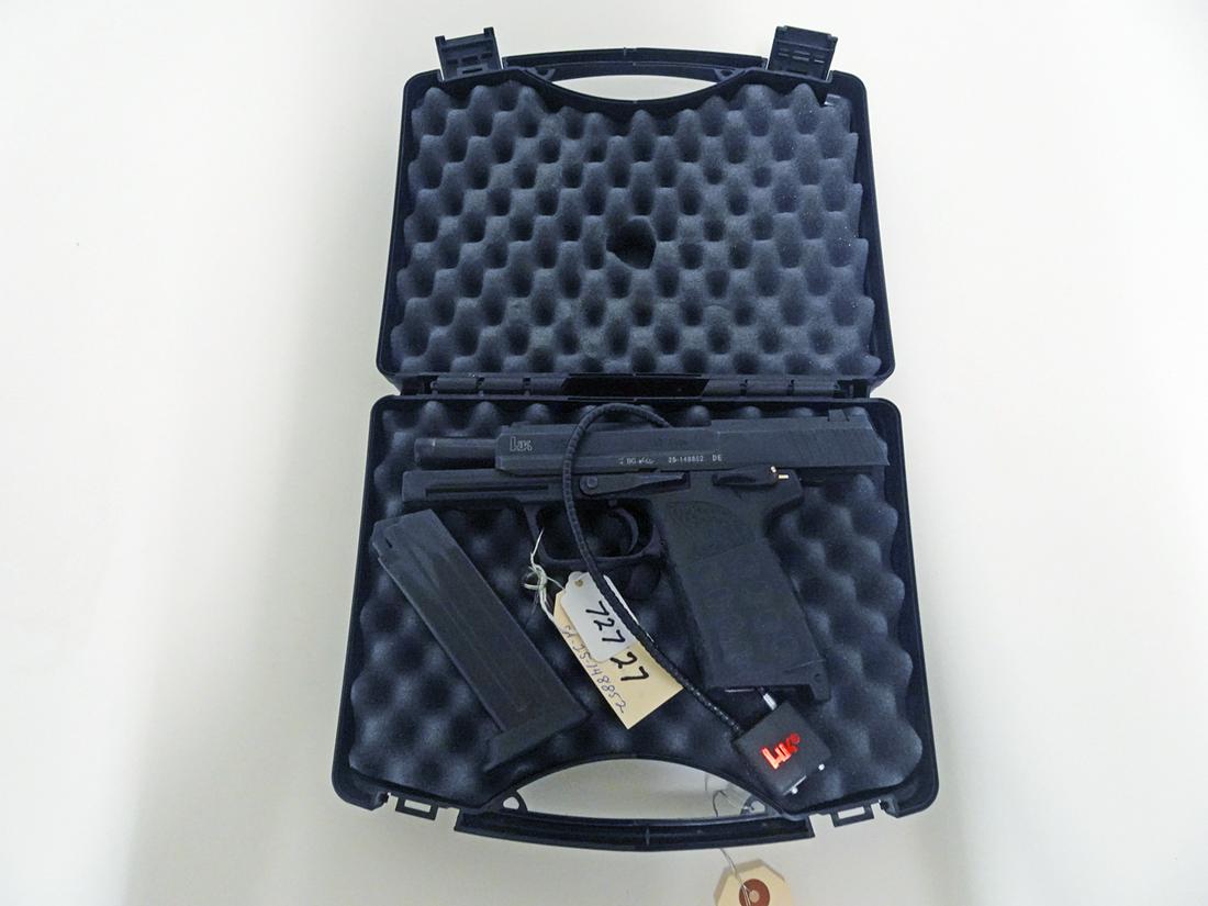 Heckler & Koch Model USP Double Action Pistol: Heckler & Koch model USP pistol, double action, .45 caliber, 12 shot, magazine feed, serial number 25-148852, barrel length 4 1/4", overall length 7 3/4", comes with hard side carry case and cable loc